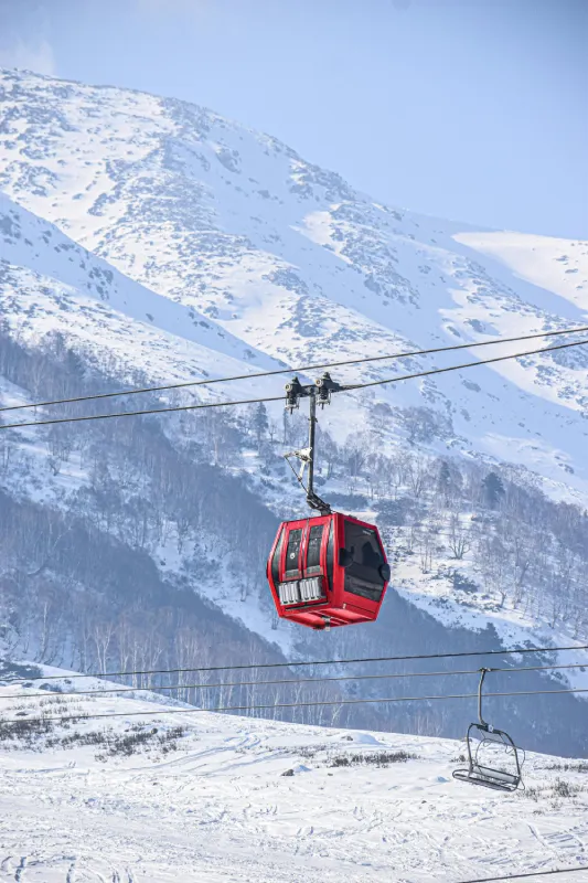 Gulmarg Gondola cable car ride over snow covered slopes in Kashmir